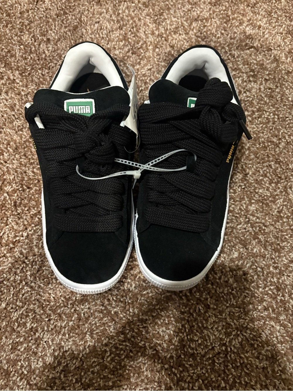 Puma Kids Black and White Suede-Style Sneakers with Green Logo